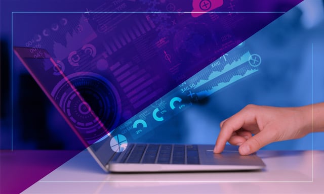 Hand on laptop keyboard with digital graphs and data projected on screen, symbolizing data-driven strategic planning.