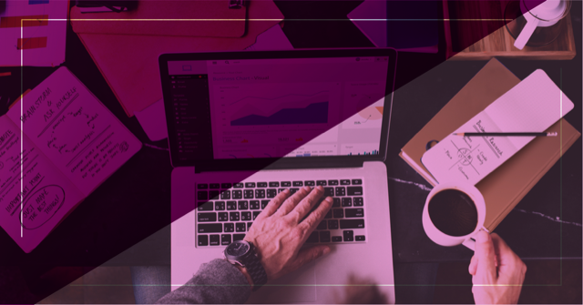 Person using laptop with performance graphs on screen while holding a cup of coffee, representing analysis and review of digital marketing strategies.